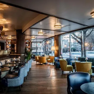 a view of a restaurant with tables and chairs