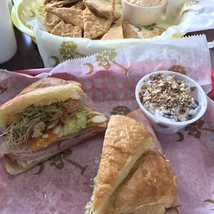 This is California Dreaming Croissant with Ham, avocado, sprouts, tomato, slivered almonds, cheddar, honey mustard drizzle.