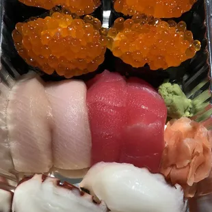 from the top: Ikura (salmon roe) Hamachi &amp; Maguro (yellow tail &amp; tuna) Tako (octopus)