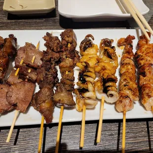 a variety of meat skewers