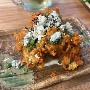 Spicy chicken karaage - topped with Bleu cheese and served over togarashi ranch. Fans of buffalo wings will be in Heaven.