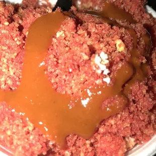 Elotes cup topped with hot cheetos