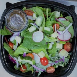 Mixed Green Salad.  Compliment the salad with choice of Chicken Breast, Ribeye Steak, or Atlantic Salmon