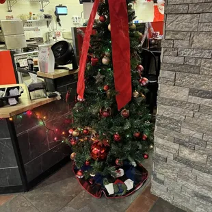 a decorated christmas tree in a store