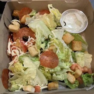 Salad $6.50.   Dressing $1.50....  Salads are served dry!