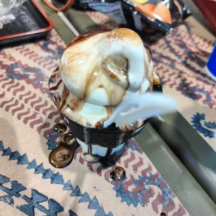 Sundae was served with fudge dripping everywhere.