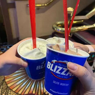 two cups of blizzard ice cream