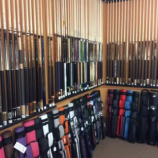 Approximately 200 cues and dozens of cases in stock.