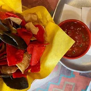 Chips with salsa and chunky guacamole.