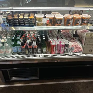 Condiments, drinks, and other items for sale.