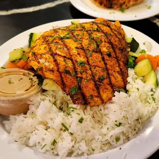 Blackened salmon, white herb rice, and vegetable medley.