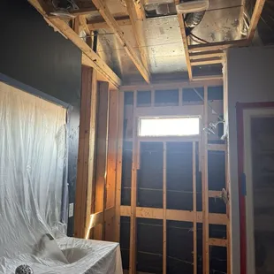 Primary bath after demo, water was in the walls