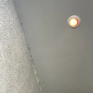 a bathroom with a light on the ceiling