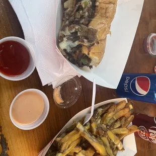 Great food I had a mixed Philly cheesesteak with lamb and beef and an order of cheese fries that were both delicious .