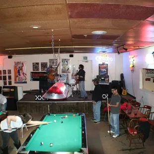 a group of people playing pool