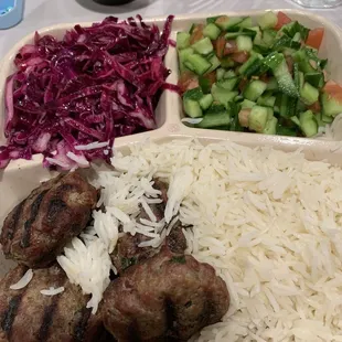 Beef Kebab Plate with red cabbage and beets, Israeli Salad and rice