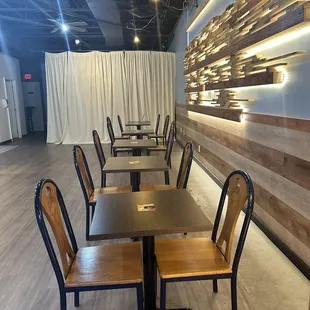empty tables and chairs in a restaurant