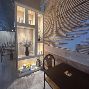 a dining room with a table and chairs