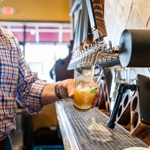 a man pouring a drink
