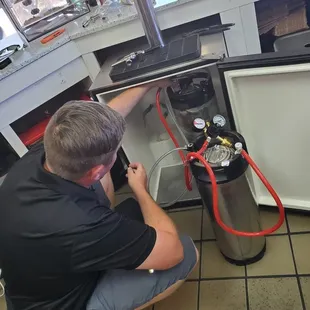 Checking gas lines for leaks.