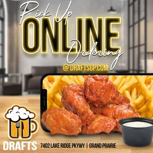 a picture of a plate of wings and fries