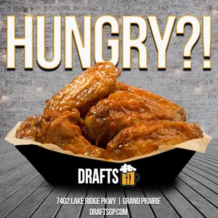 a basket of chicken wings with the words hungry?