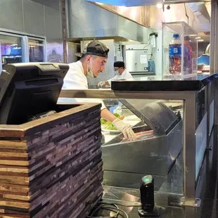 preparing food not wearing a mask.