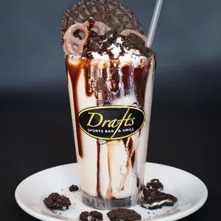a chocolate milkshake with a donut on top