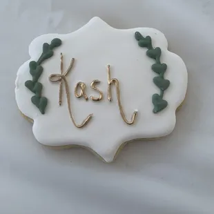 a decorated cookie with the word kosh