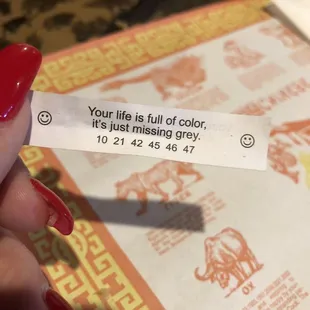 a hand holding a piece of paper that says your life is full of color, it's just missing god