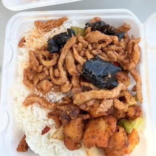 a variety of food in a styrofoam container