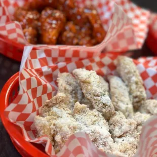 two baskets of fried chicken