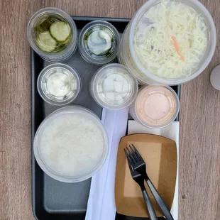 Coleslaw salad, radish, and pickles