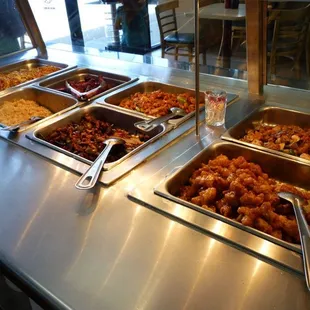 a variety of food in a buffet