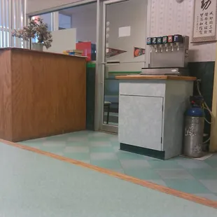 Cheesy plywood desk with phone books