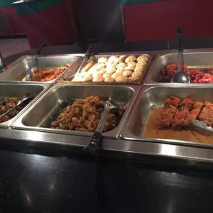 a variety of food items in a buffet