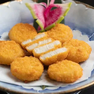 a plate of deep fried fish cakes