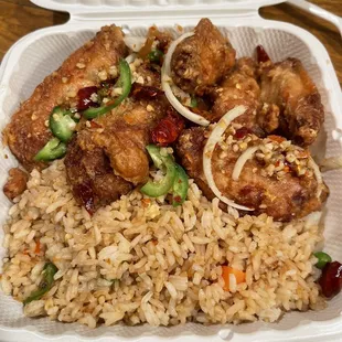 Dinner platter with fried rice and salt and pepper chicken wings