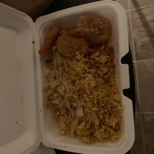 chicken and rice in a styrofoam container