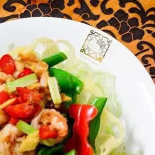 a plate of shrimp and vegetables
