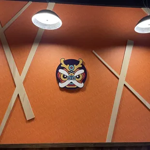 the emblem on the wall of a restaurant