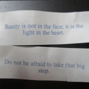 two pieces of toilet paper with the words beauty is not in the face, it is the light in the heart