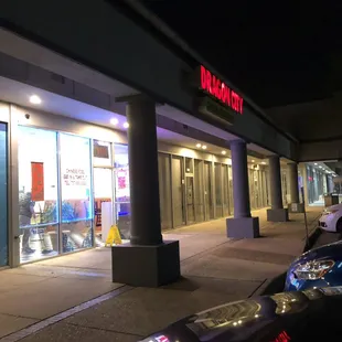 the outside of a restaurant at night