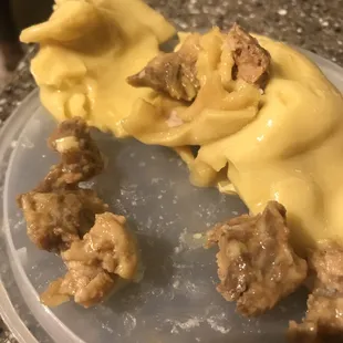 a plate of pasta with meat and cheese