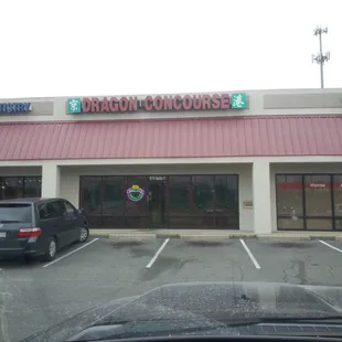 a car parked in front of a restaurant