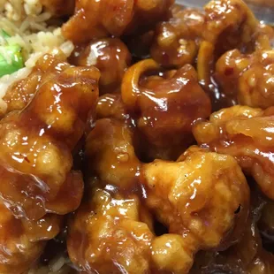 a plate of food with rice and broccoli
