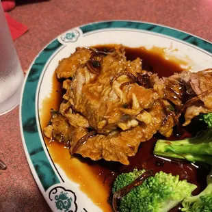 Supposed to be fried orange pork.  I think it came from a dead human corpse with maggots.