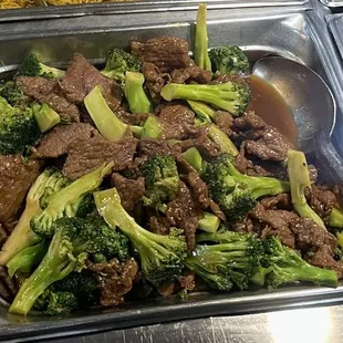 Beef with broccoli. NOT smothered by a greasy sauce. The beef is thick and tender.