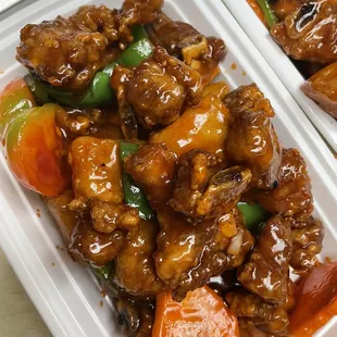 two takeout containers of food