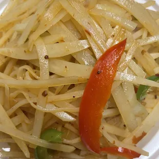 a plate of noodles and peppers